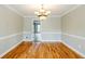Elegant dining room with hardwood floors and an ornate chandelier lighting the space at 5611 Manassas Run, Stone Mountain, GA 30087