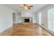 Elegant living area with hardwood flooring, fireplace and built-in bookshelves at 5611 Manassas Run, Stone Mountain, GA 30087