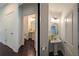 A cute powder room with a pedestal sink and neutral color palette at 1977 Boyd Trace Nw Ln, Atlanta, GA 30318