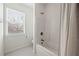 Bright bathroom with a shower-tub combination and tiled flooring at 1977 Boyd Trace Nw Ln, Atlanta, GA 30318