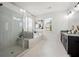 Bright bathroom featuring a glass enclosed shower and soaking tub at 1977 Boyd Trace Nw Ln, Atlanta, GA 30318