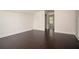 A spacious bedroom with hardwood floors and crisp white walls at 1977 Boyd Trace Nw Ln, Atlanta, GA 30318