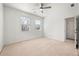 Bright carpeted bedroom with natural light and a ceiling fan at 1977 Boyd Trace Nw Ln, Atlanta, GA 30318