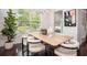 Bright dining room with stylish chandelier, wooden table, and modern chairs at 1977 Boyd Trace Nw Ln, Atlanta, GA 30318