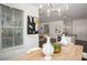 Dining area flows into the kitchen, featuring modern lighting and decor at 1977 Boyd Trace Nw Ln, Atlanta, GA 30318