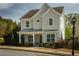 Inviting two-story home featuring a charming front porch with manicured landscaping and a welcoming entrance at 1977 Boyd Trace Nw Ln, Atlanta, GA 30318
