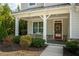 Charming front porch with inviting entrance, well-maintained landscaping, and lovely architectural details at 1977 Boyd Trace Nw Ln, Atlanta, GA 30318
