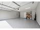 Spacious garage with gray epoxy flooring and storage shelves at 1977 Boyd Trace Nw Ln, Atlanta, GA 30318