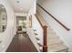 Welcoming hallway with hardwood floors, staircase, and view into the living room at 1977 Boyd Trace Nw Ln, Atlanta, GA 30318
