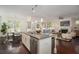 Open kitchen with island bar seating, stainless steel dishwasher, and view into the living area at 1977 Boyd Trace Nw Ln, Atlanta, GA 30318