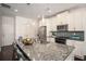 Kitchen island with bar seating, stainless steel appliances, granite countertops and pendant lighting at 1977 Boyd Trace Nw Ln, Atlanta, GA 30318