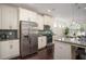 Modern kitchen with stainless steel appliances, sleek granite counters, and subway tile backsplash at 1977 Boyd Trace Nw Ln, Atlanta, GA 30318