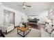 Bright and airy living room open to the kitchen with hardwood floors and modern furnishings at 1977 Boyd Trace Nw Ln, Atlanta, GA 30318