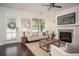 Cozy living room with fireplace, modern decor, and natural light streaming in through large windows at 1977 Boyd Trace Nw Ln, Atlanta, GA 30318