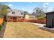 Spacious backyard, modern two-story home, featuring a large lawn and driveway at 387 S Howard Se St, Atlanta, GA 30317