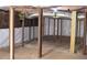 Unfinished basement showcasing support beams, ductwork, and partial vapor barrier at 387 S Howard Se St, Atlanta, GA 30317