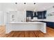 Contemporary kitchen showcasing a large island with white countertop and navy blue cabinetry at 387 S Howard Se St, Atlanta, GA 30317