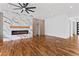 Bright, open living room with hardwood floors and a modern fireplace with marble surround at 387 S Howard Se St, Atlanta, GA 30317