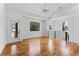 Bright living room with hardwood floors, a vaulted ceiling, and large windows offering plenty of natural light at 387 S Howard Se St, Atlanta, GA 30317