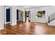 Bright living room with hardwood floors, modern staircase, and large windows allowing for ample natural light at 387 S Howard Se St, Atlanta, GA 30317
