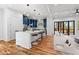 Inviting open-concept living area features a large kitchen island with seating and cozy living space at 387 S Howard Se St, Atlanta, GA 30317