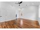 Spacious bedroom with hardwood floors, a ceiling fan, and natural light, creating a relaxing atmosphere at 387 S Howard Se St, Atlanta, GA 30317