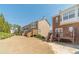 Exterior view of the townhome complex and backyard at 2164 Mill Garden Run, Buford, GA 30519