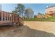 View of backyard showing the deck, fence, and lawn at 2164 Mill Garden Run, Buford, GA 30519