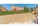 Spacious lawn area with green shrubs and wooden decks at 2164 Mill Garden Run, Buford, GA 30519