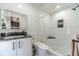 Stylish bathroom with white marble-like tiling, new fixtures, and a modern vanity and shower at 2164 Mill Garden Run, Buford, GA 30519