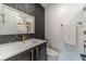 Contemporary bathroom with modern tiling, new fixtures, and a sleek vanity and lighting at 2164 Mill Garden Run, Buford, GA 30519