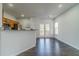 Open dining area with hardwood floors, stainless steel appliances, and access to a patio area through French doors at 2164 Mill Garden Run, Buford, GA 30519