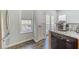 Cozy kitchen nook featuring a window with backyard views and granite countertops at 2164 Mill Garden Run, Buford, GA 30519