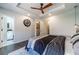 Main bedroom view showing tray ceiling, walk-in closet and ensuite bathroom at 2164 Mill Garden Run, Buford, GA 30519