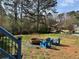 Spacious backyard with a fire pit and Adirondack chairs, perfect for outdoor entertaining at 3810 Galloway Dr, Roswell, GA 30075