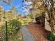 Charming backyard with beautiful landscaping, rock path, plants, and trees at 3810 Galloway Dr, Roswell, GA 30075