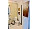 Stylish half bath with a unique vessel sink and modern mosaic tile at 3810 Galloway Dr, Roswell, GA 30075