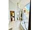 Well-lit bathroom featuring a corner tub, separate glass shower, and modern fixtures at 3810 Galloway Dr, Roswell, GA 30075