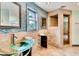 Beautiful bathroom boasts mosaic tile accent wall, clear glass bowl sink, and walk-in shower at 3810 Galloway Dr, Roswell, GA 30075