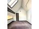 Spacious bedroom with vaulted ceiling and a skylight for ample natural lighting at 3810 Galloway Dr, Roswell, GA 30075