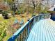 Overhead view of a blue stained deck with fire pit and chairs at 3810 Galloway Dr, Roswell, GA 30075