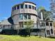 Unique home exterior featuring multi-story design, outdoor deck, and ample yard space at 3810 Galloway Dr, Roswell, GA 30075