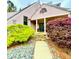 Charming home with lush landscaping, stone path, and decorative door at 3810 Galloway Dr, Roswell, GA 30075