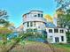 Stunning, turreted home with a beautiful blue deck, charming landscaping, and ample natural light at 3810 Galloway Dr, Roswell, GA 30075