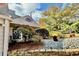 Landscaped front yard with manicured lawn, rock border, and banana trees giving a tropical feel at 3810 Galloway Dr, Roswell, GA 30075