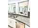 Updated kitchen with granite countertops, stainless steel appliances, and open layout to the adjacent room at 3810 Galloway Dr, Roswell, GA 30075