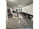 Modern kitchen featuring white cabinets, stainless steel appliances, granite countertops, and ample countertop space at 3810 Galloway Dr, Roswell, GA 30075