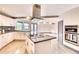 Kitchen features white cabinets, granite countertops, stainless steel appliances, and an island at 3810 Galloway Dr, Roswell, GA 30075