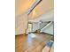 Open-concept living room featuring wood floors, a staircase, and a bright window at 3810 Galloway Dr, Roswell, GA 30075