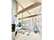 Bright living room features exposed beams, light floors, and a cozy hanging chair at 3810 Galloway Dr, Roswell, GA 30075
